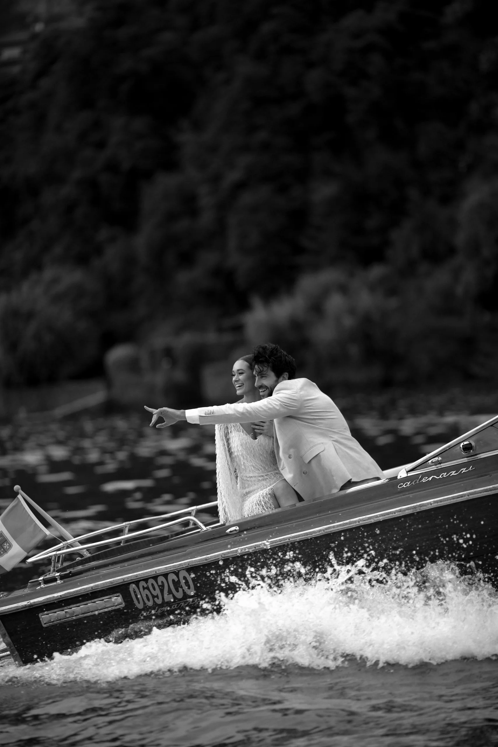 Bride and groom on a boat at sunset on Lake Como – cinematic wedding photo