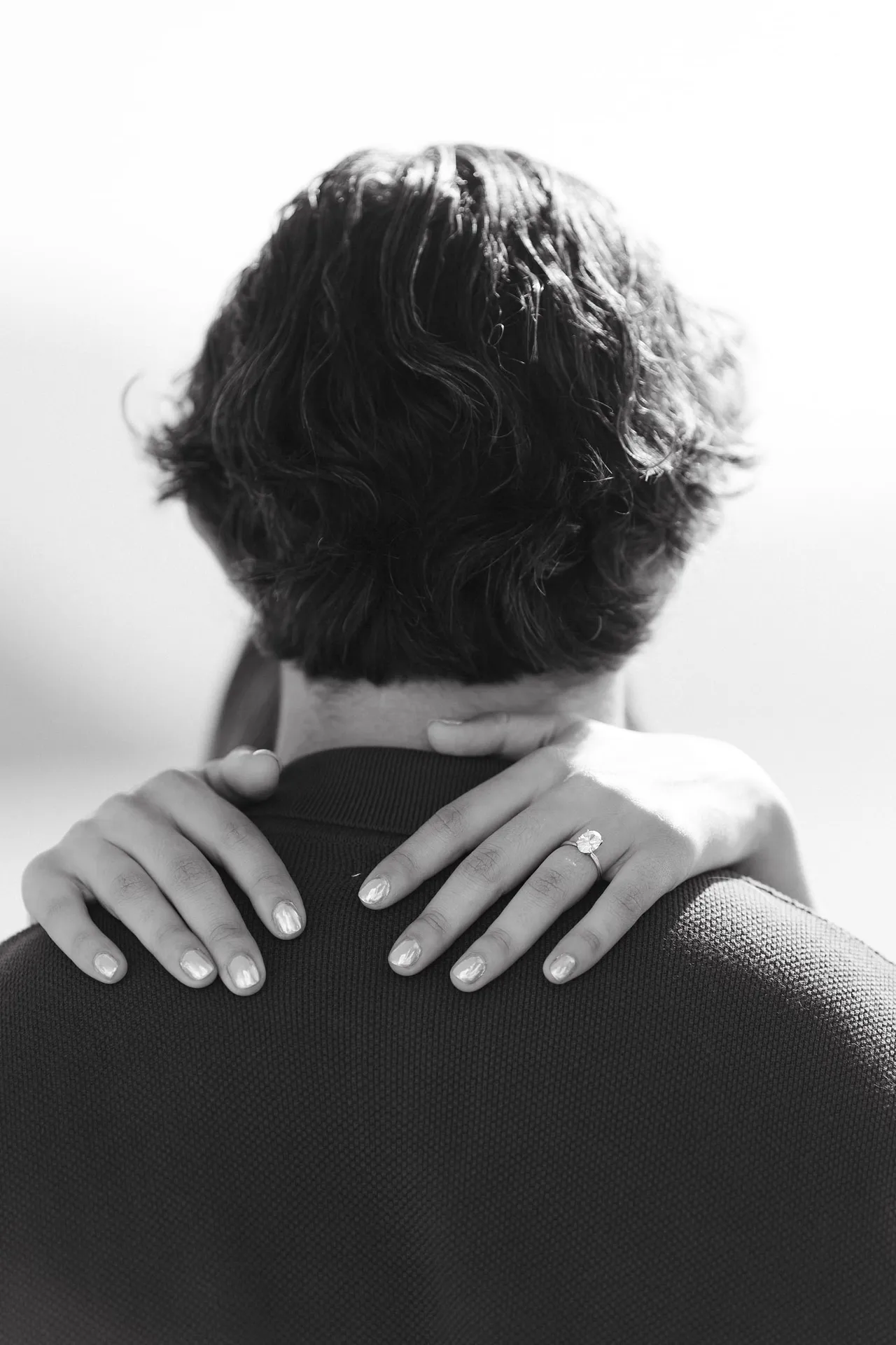 Black and white engagement ring portrait on Lake Como